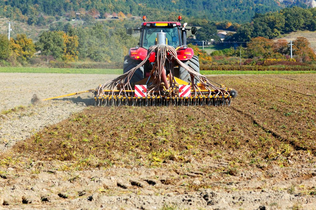 Ploughing heavy tractor during cultivation